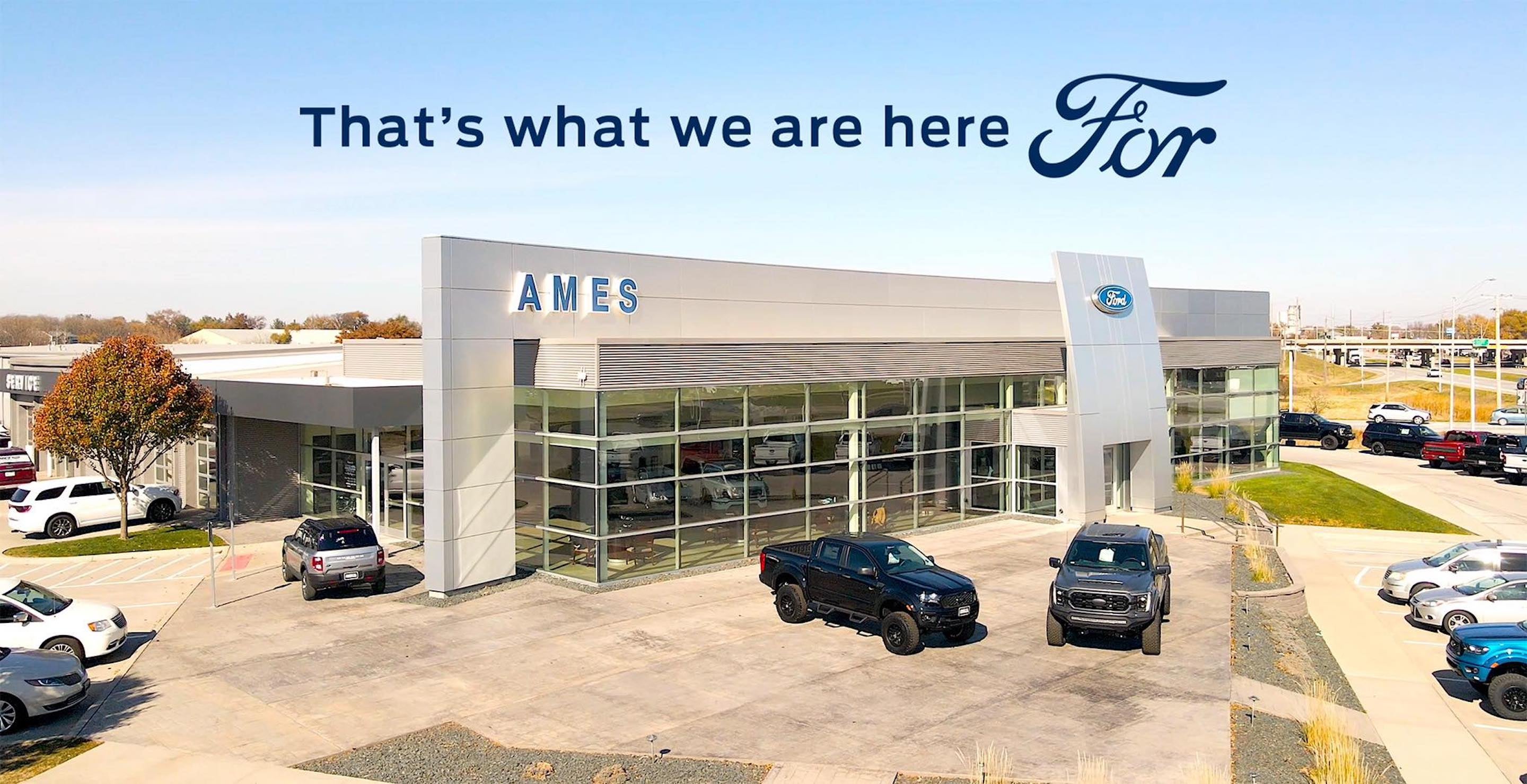 Dealership slogan over picture of two people